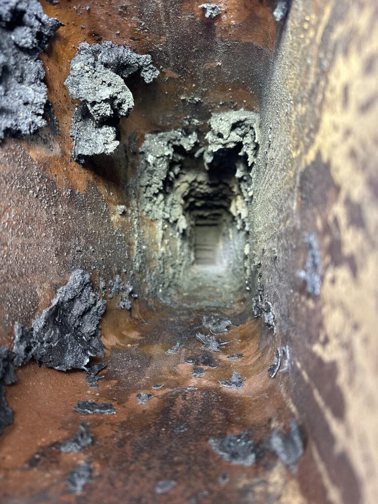 A dangerously dirty chimney with creosote buildup